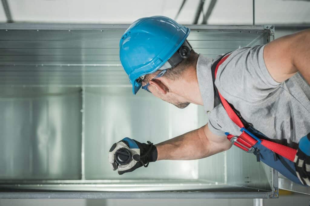 Technician Checking the Ventilation Duct